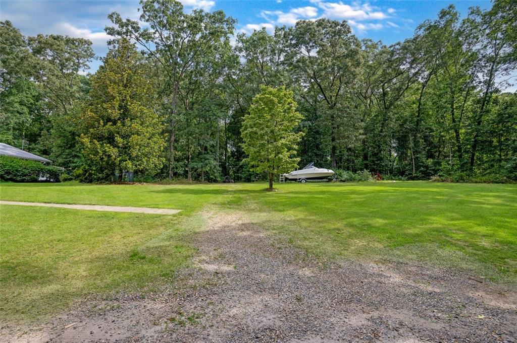 5364 Post Road Cumming, GA 30040 - Photo 5 of 12 a view of a field with grass and trees