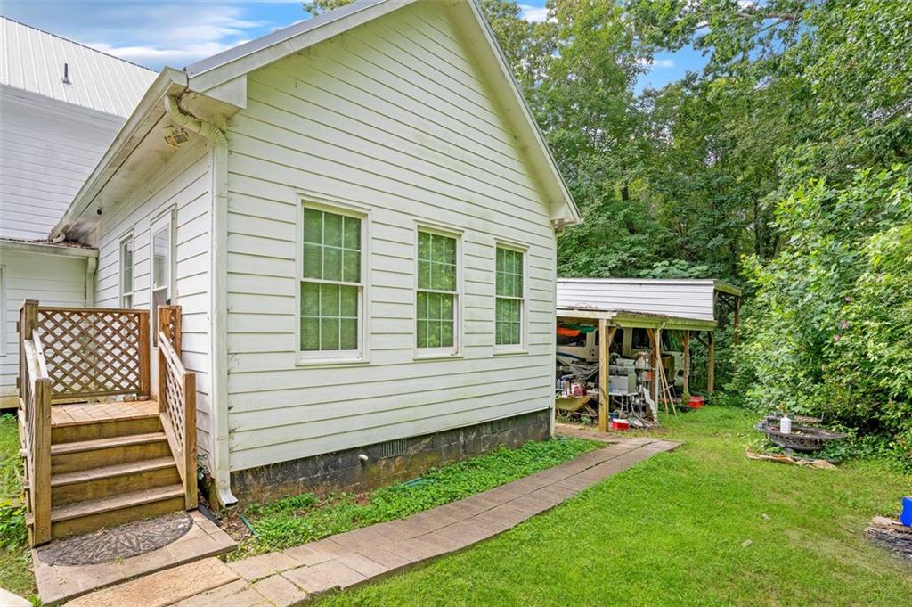 5364 Post Road Cumming, GA 30040 - Photo 7 of 12 a front view of a house with a garden