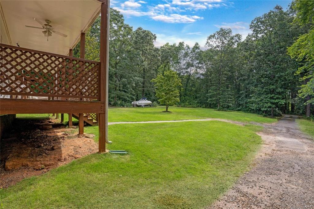 5364 Post Road Cumming, GA 30040 - Photo 10 of 12 a view of a field with a tree