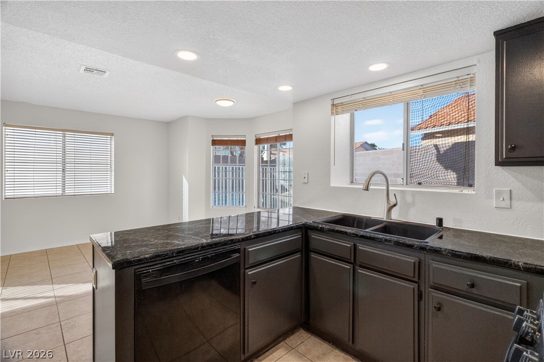 3156 Terrace View Drive Laughlin, NV 89029 - Photo 17 of 94 A well-appointed kitchen showcases rich dark cabinetry and ample counter space.