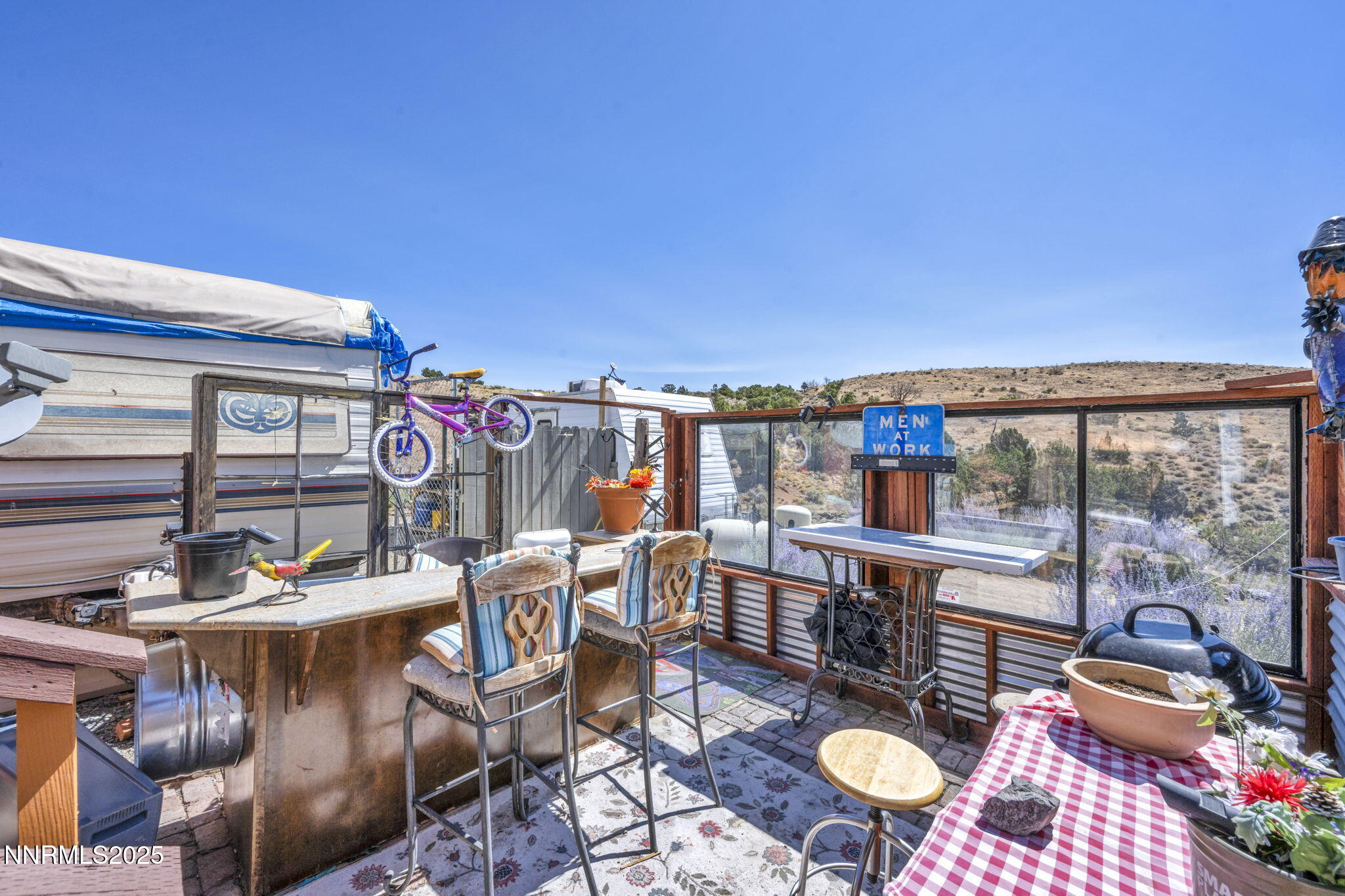 8560 Chimney Road, Unit GOOGLE MAPS IS NOT ACCURATE Sparks, NV 89436 - Photo 38 of 46 a outdoor dining space with furniture and stove