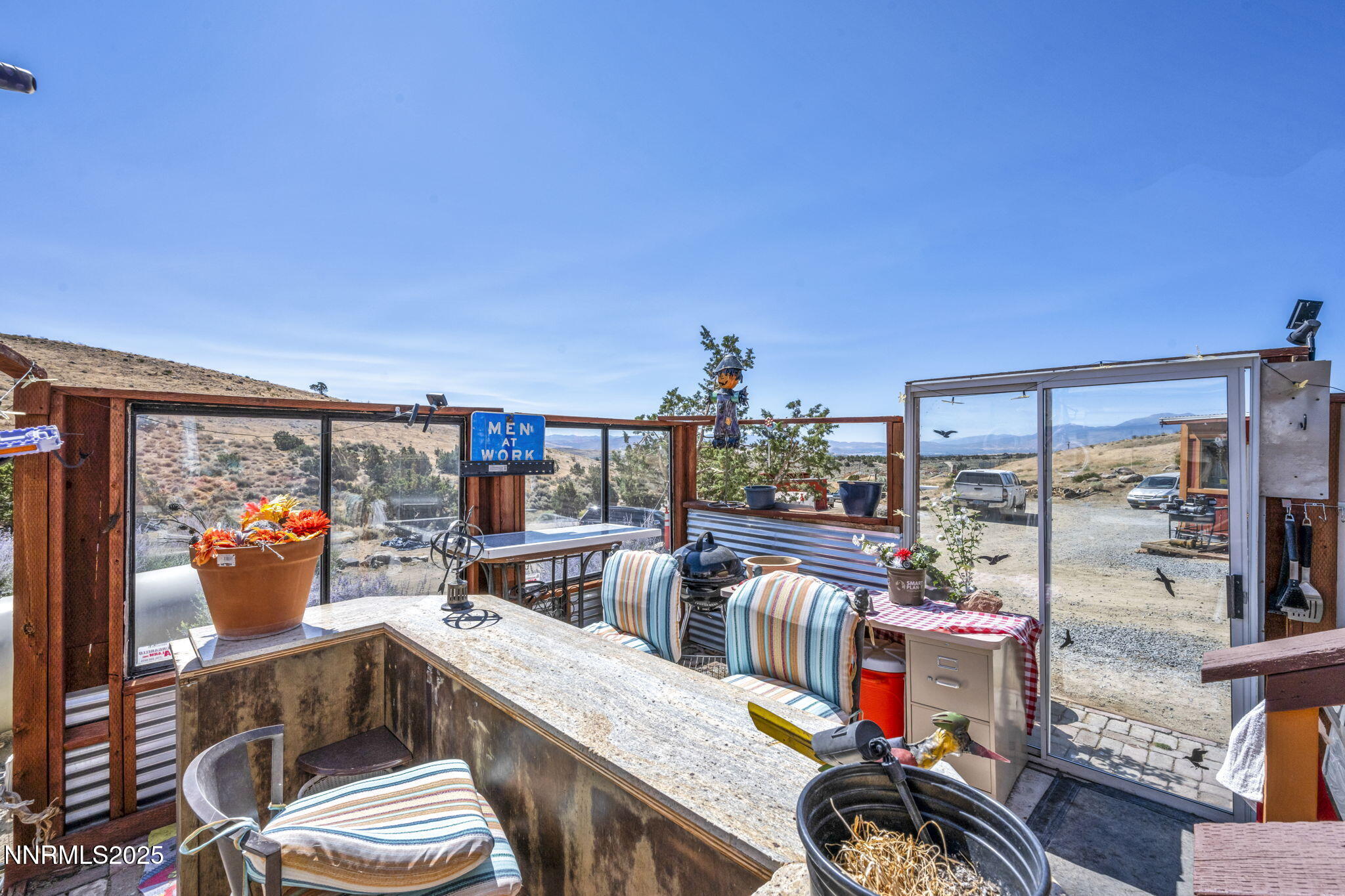 8560 Chimney Road, Unit GOOGLE MAPS IS NOT ACCURATE Sparks, NV 89436 - Photo 40 of 46 a view of a chairs and table in a patio