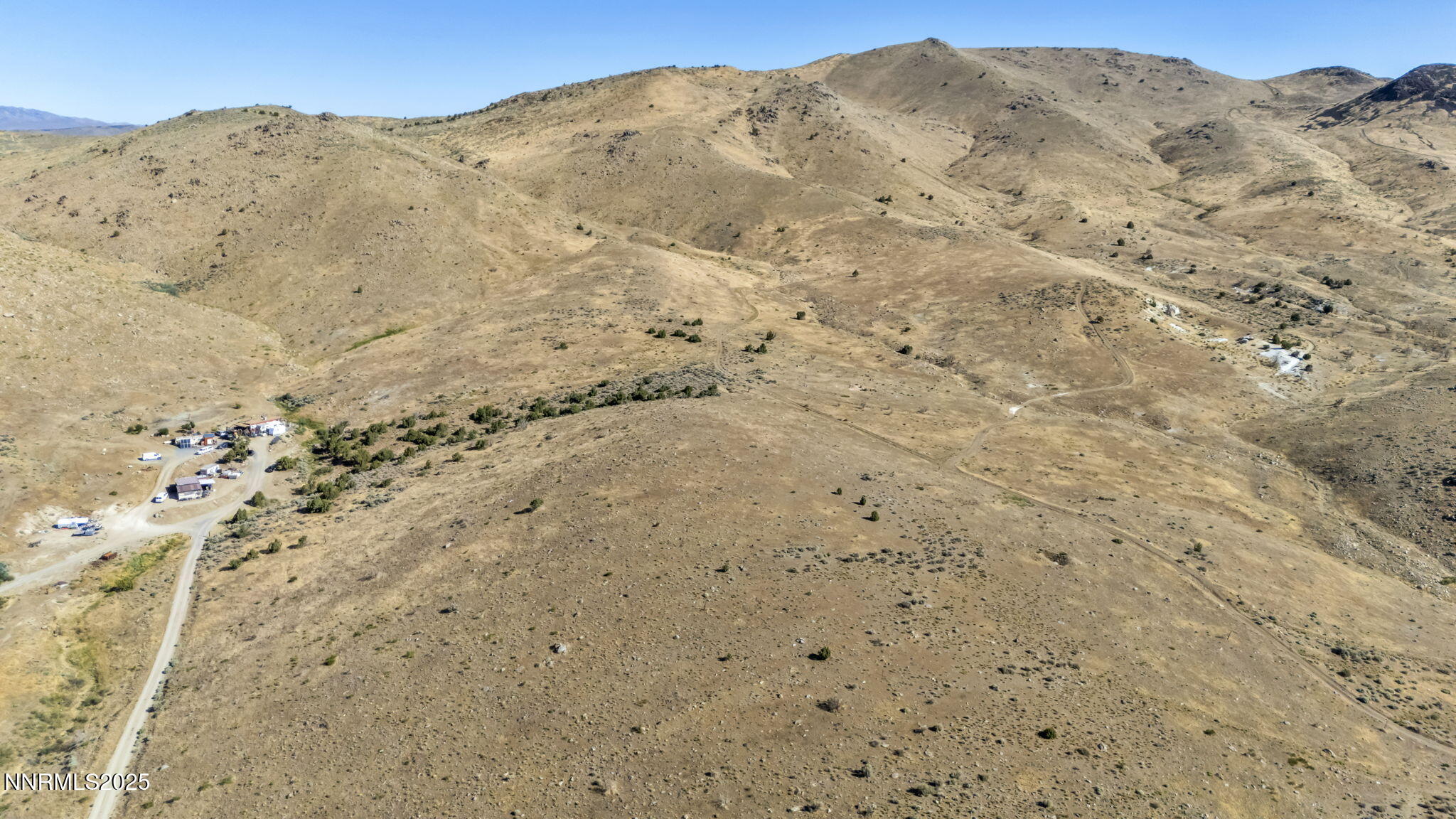 8560 Chimney Road, Unit GOOGLE MAPS IS NOT ACCURATE Sparks, NV 89436 - Photo 4 of 46 a view of a mountain range with a mountain in the background