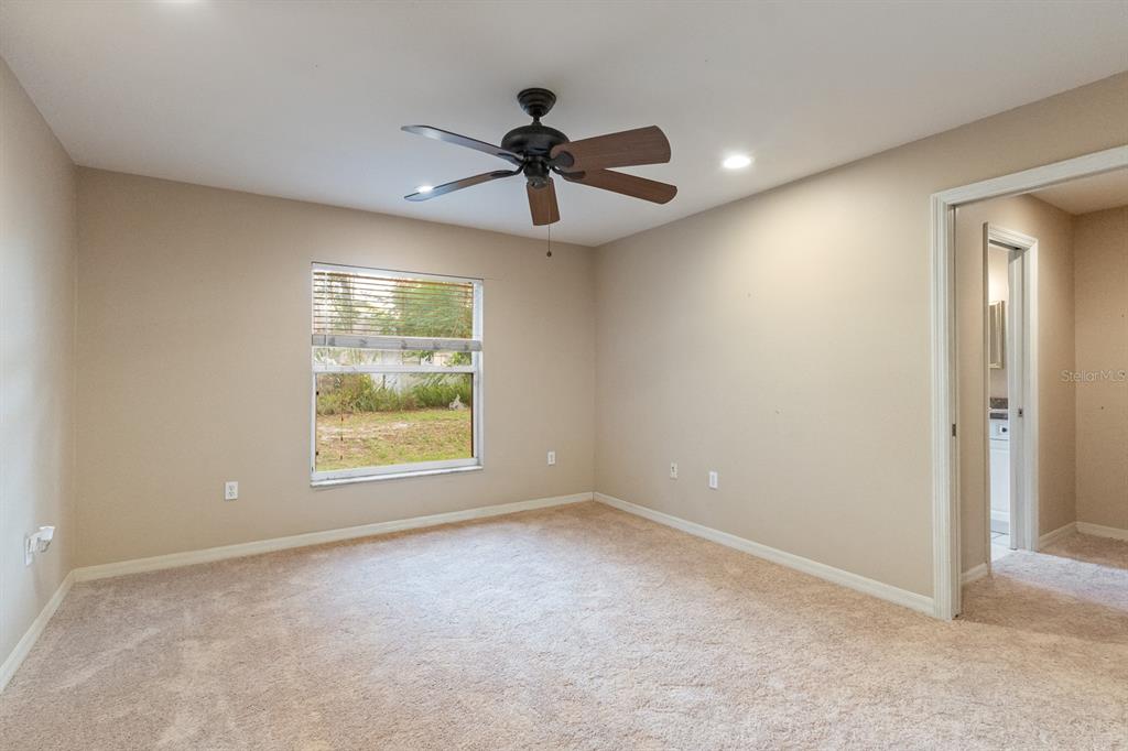 920 Hicks Road Lakeland, FL 33813 - Photo 13 of 30 Primary bedroom with new carpeting