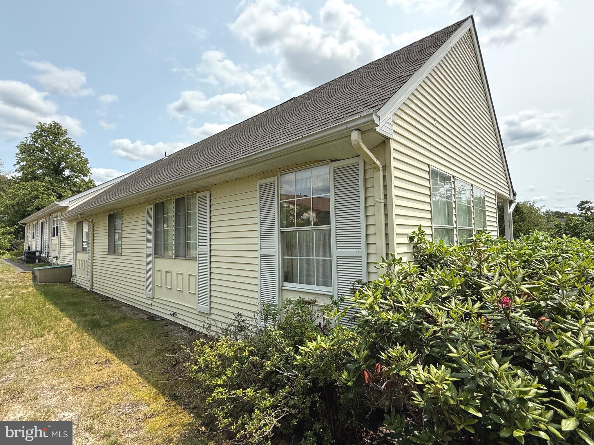16A Spring Street Manchester Township, NJ 08759 - Photo 18 of 20 a view of a house with a yard
