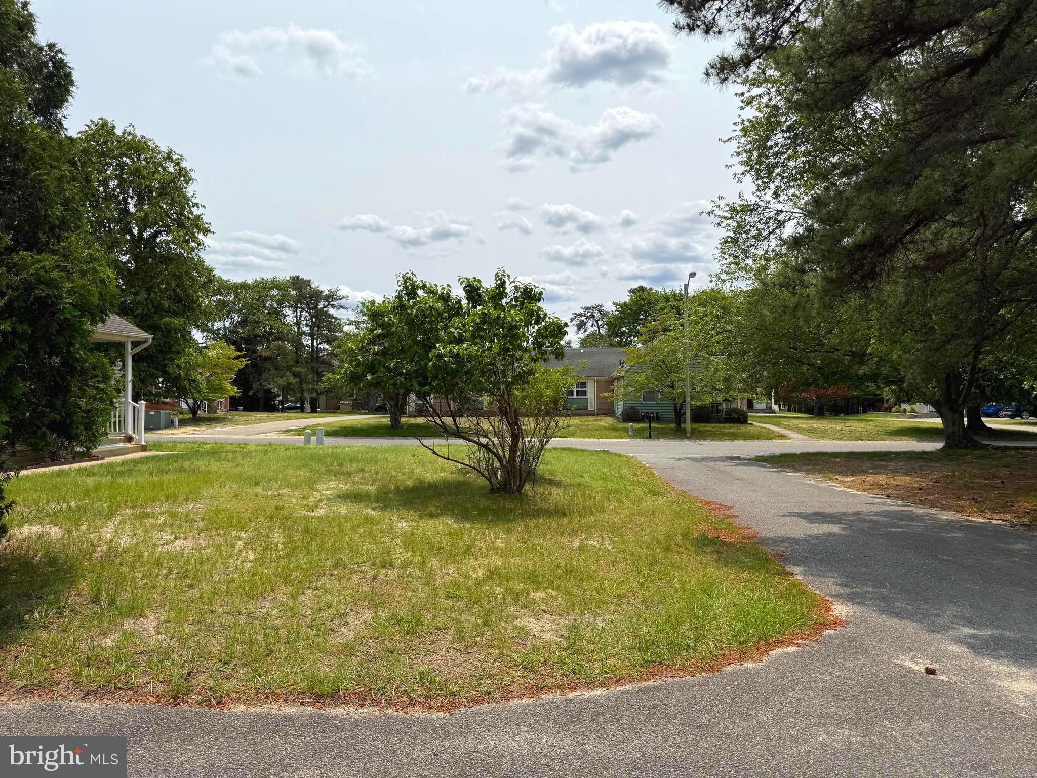 16A Spring Street Manchester Township, NJ 08759 - Photo 20 of 20 a view of a fountain in front of a house with a big yard