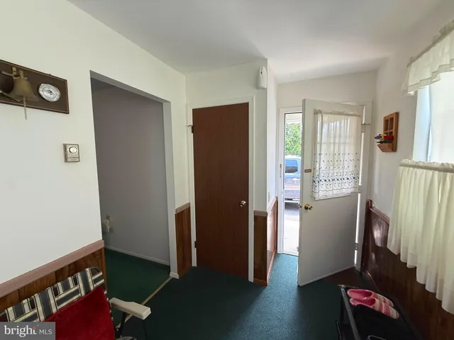 a view of kitchen with furniture and wooden floor