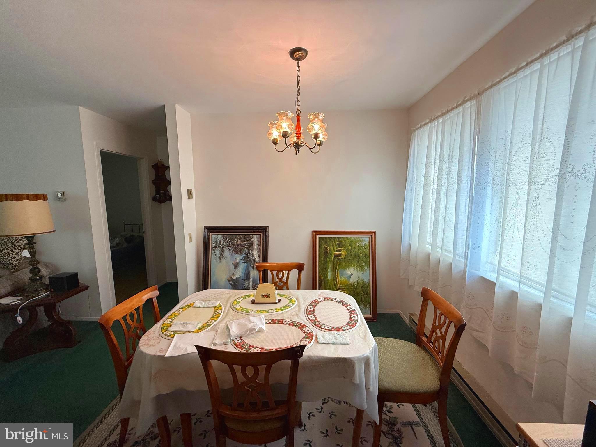16A Spring Street Manchester Township, NJ 08759 - Photo 5 of 20 a view of a dining room with furniture window and wooden floor