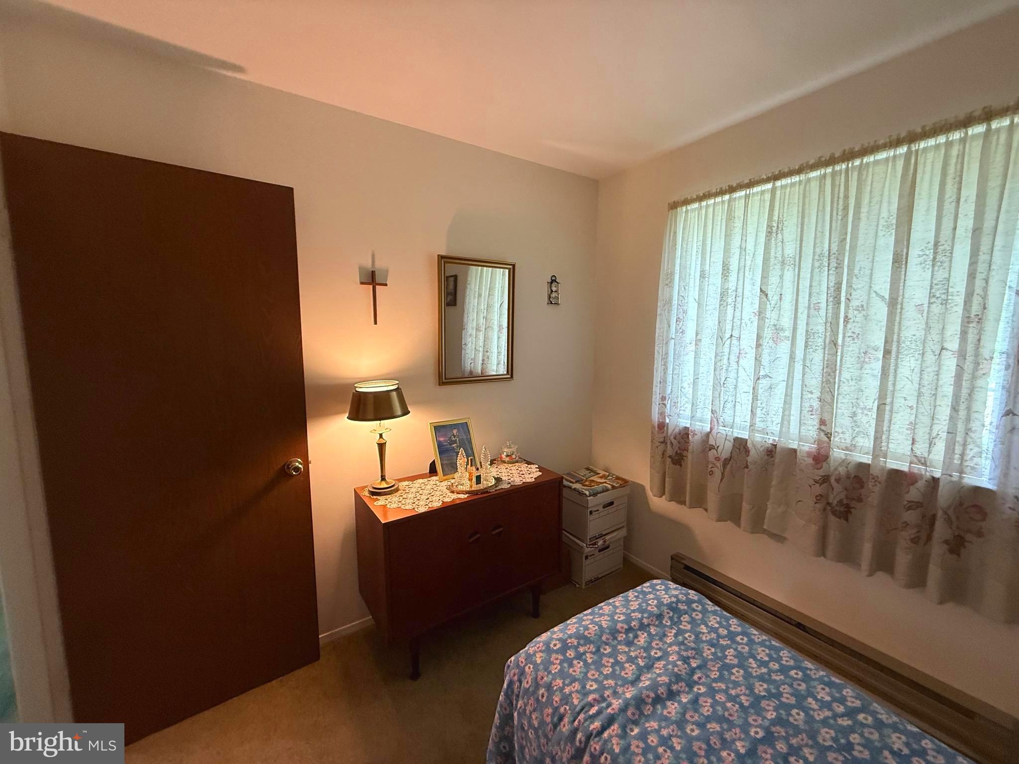 16A Spring Street Manchester Township, NJ 08759 - Photo 10 of 20 a bedroom with furniture and a window