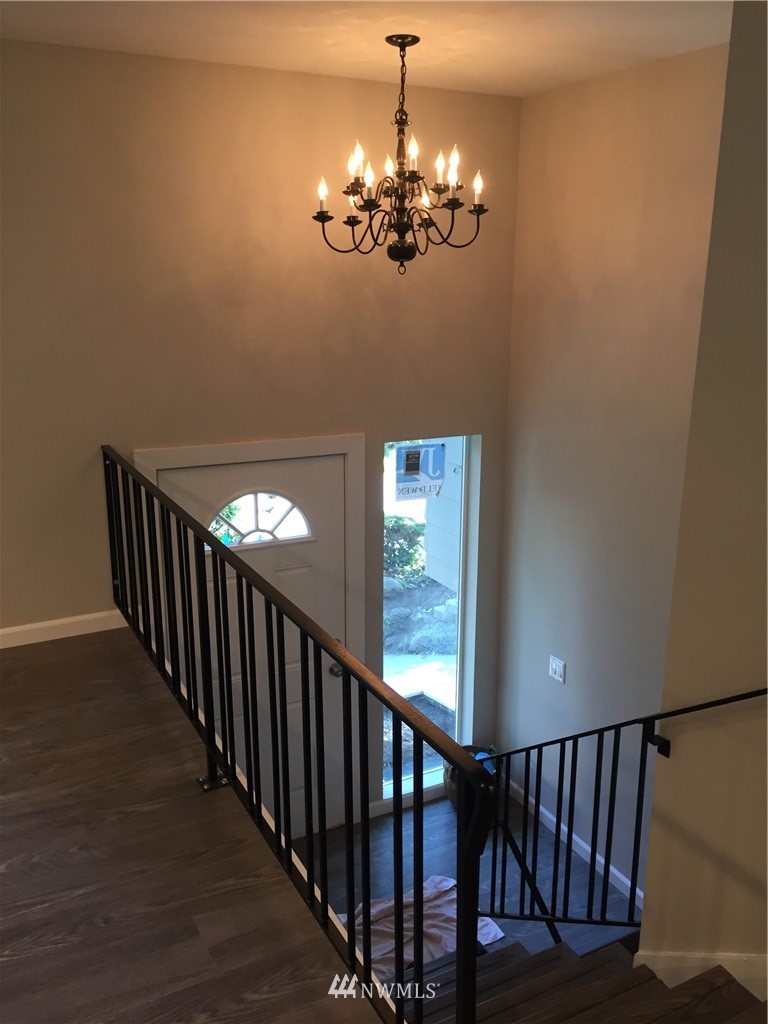 2010 Northeast 27th Street Renton, WA 98056 - Photo 6 of 16 a view of a hallway with wooden floor and staircase