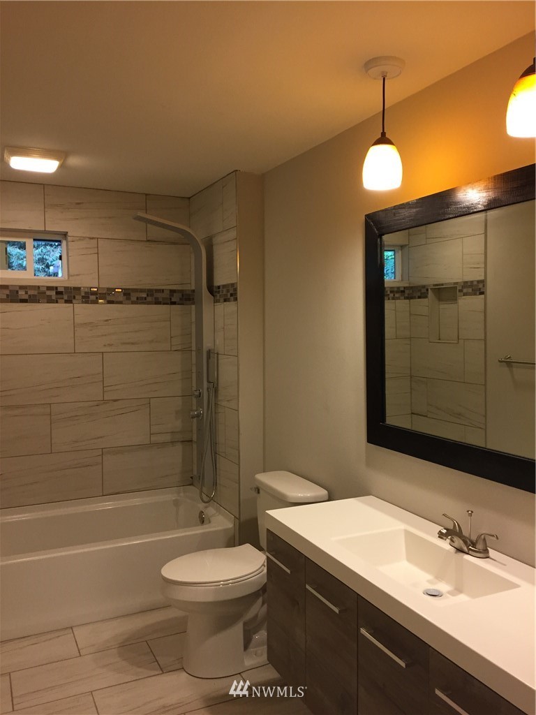 2010 Northeast 27th Street Renton, WA 98056 - Photo 7 of 16 a bathroom with a sink a toilet and shower