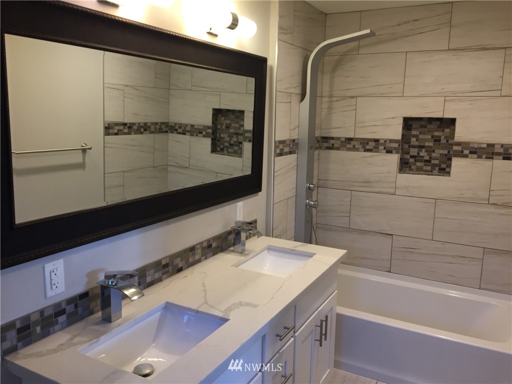 2010 Northeast 27th Street Renton, WA 98056 - Photo 9 of 16 a bathroom with a sink and a mirror