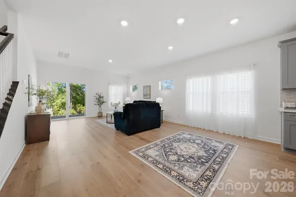 a living room with furniture and a rug