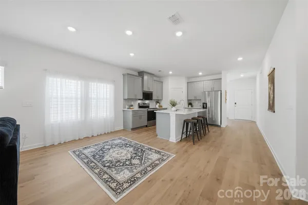 a open kitchen with a table and chairs