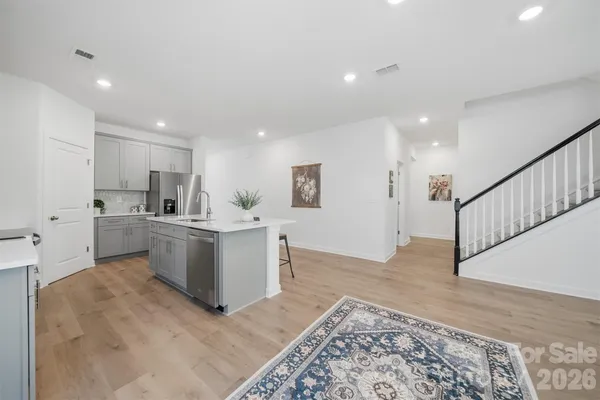 a view of kitchen with wooden floor