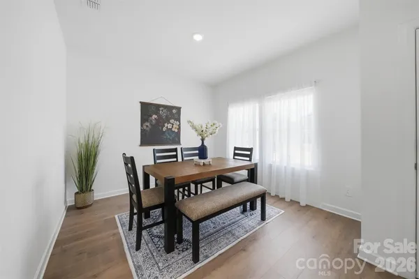 a view of a room with furniture and window