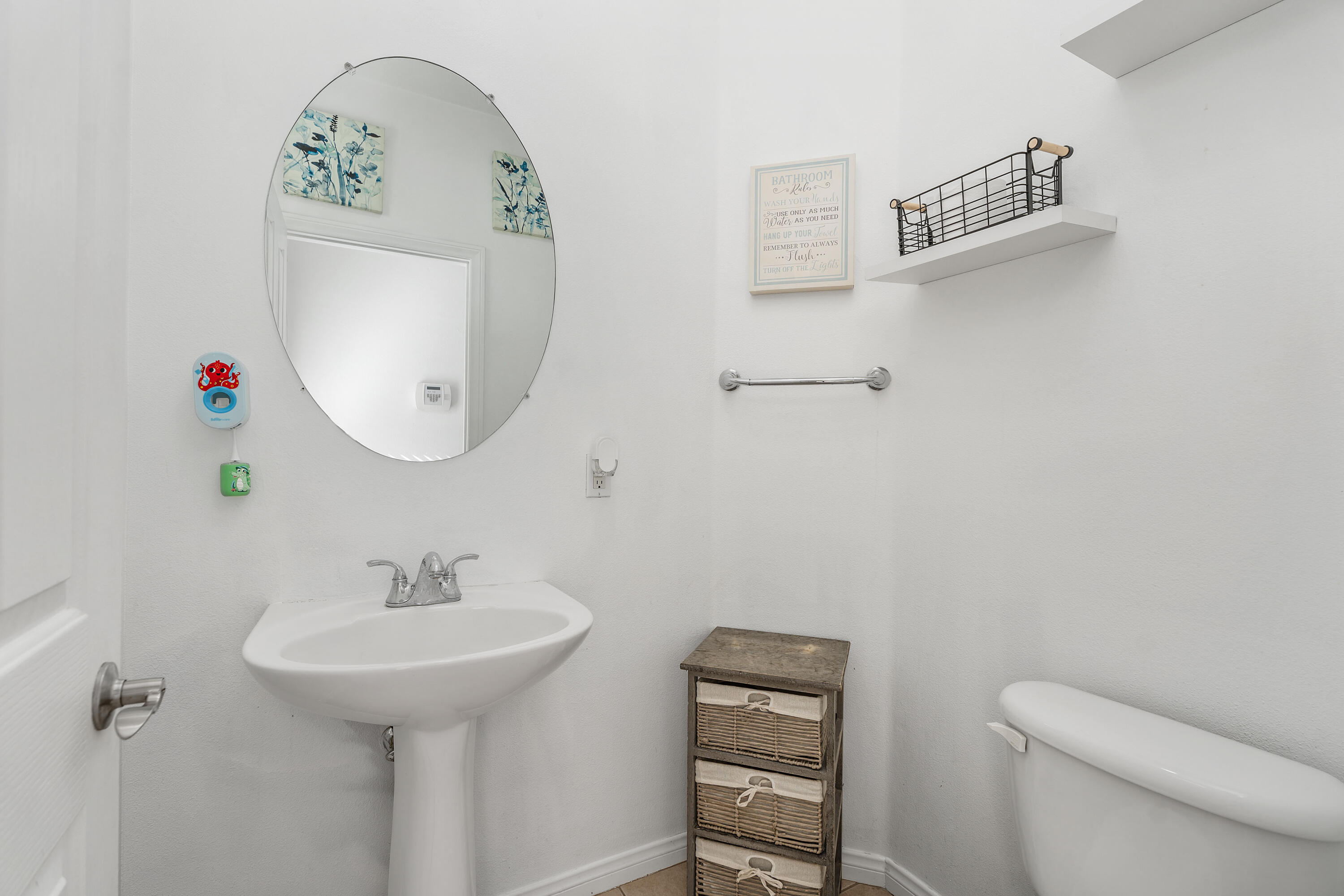 83814 Wolf Creek Road Indio, CA 92203 - Photo 15 of 28 a bathroom with a toilet sink and mirror