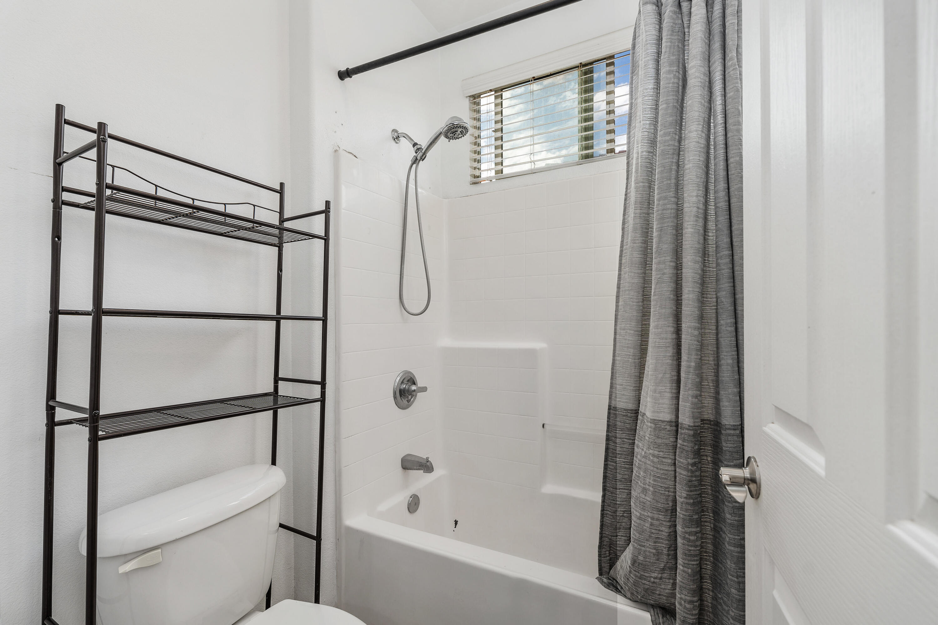 83814 Wolf Creek Road Indio, CA 92203 - Photo 18 of 28 a bathroom with a shower and a toilet