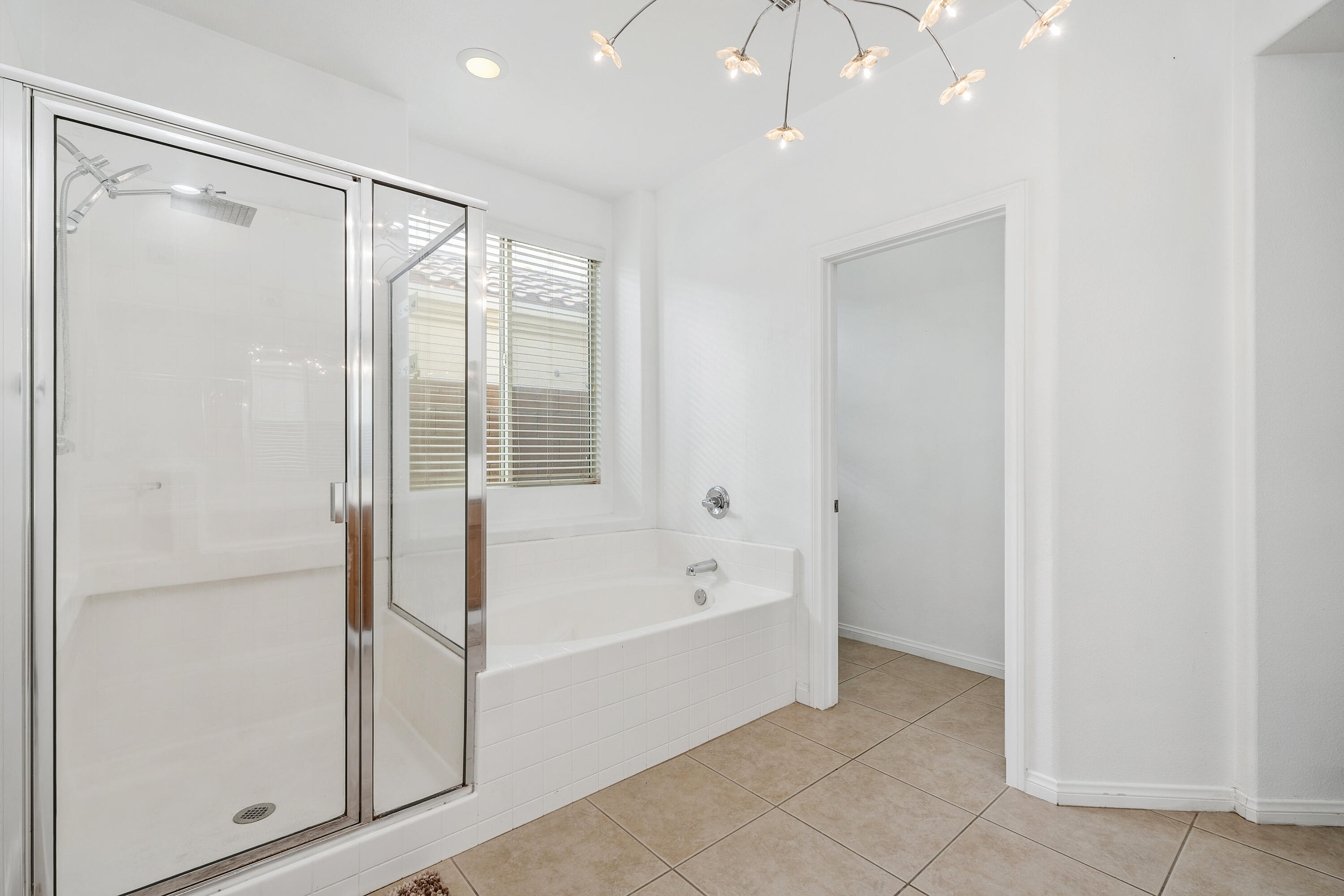83814 Wolf Creek Road Indio, CA 92203 - Photo 22 of 28 a bathroom with a bathtub and a shower