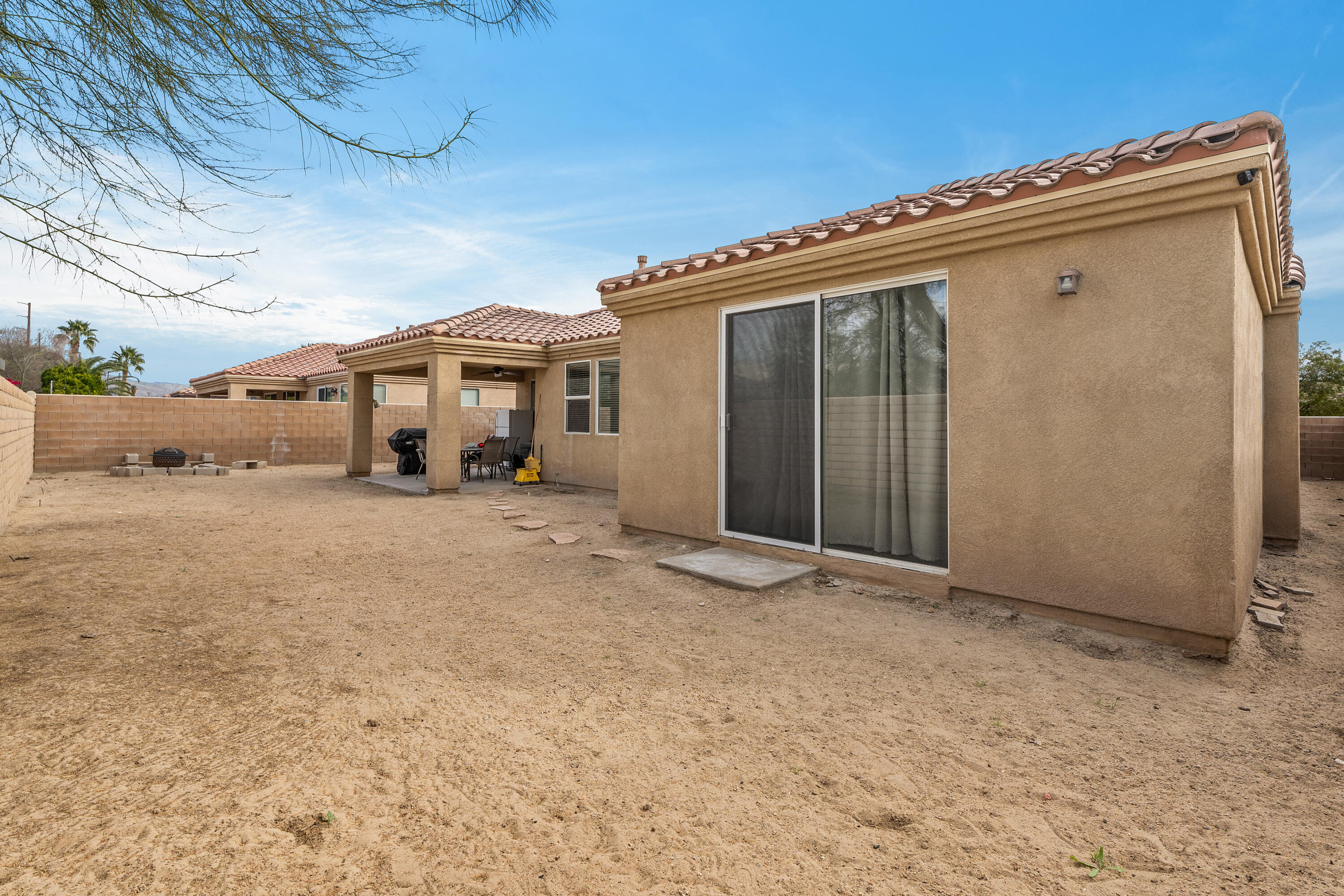 83814 Wolf Creek Road Indio, CA 92203 - Photo 25 of 28 a view of a house with a snow in the yard