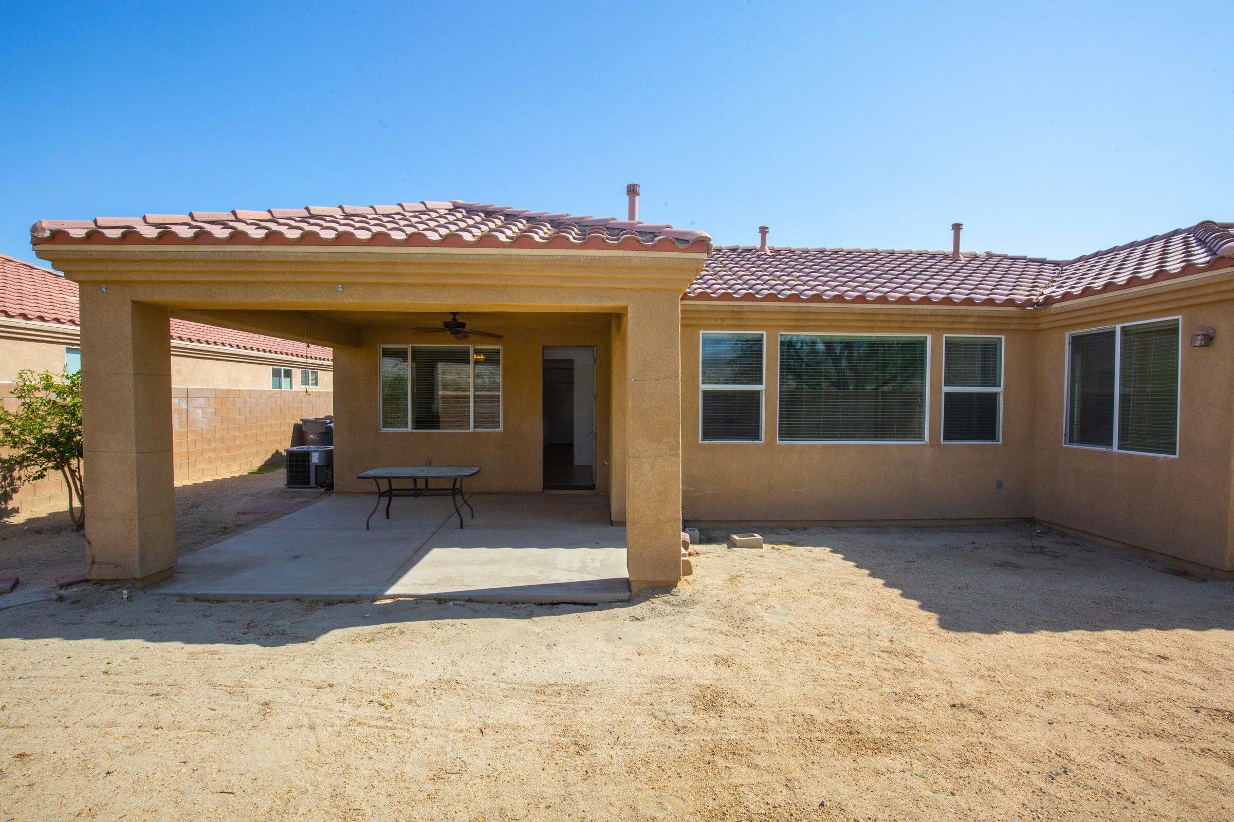 83814 Wolf Creek Road Indio, CA 92203 - Photo 28 of 28 a view of a house with a snow in the yard