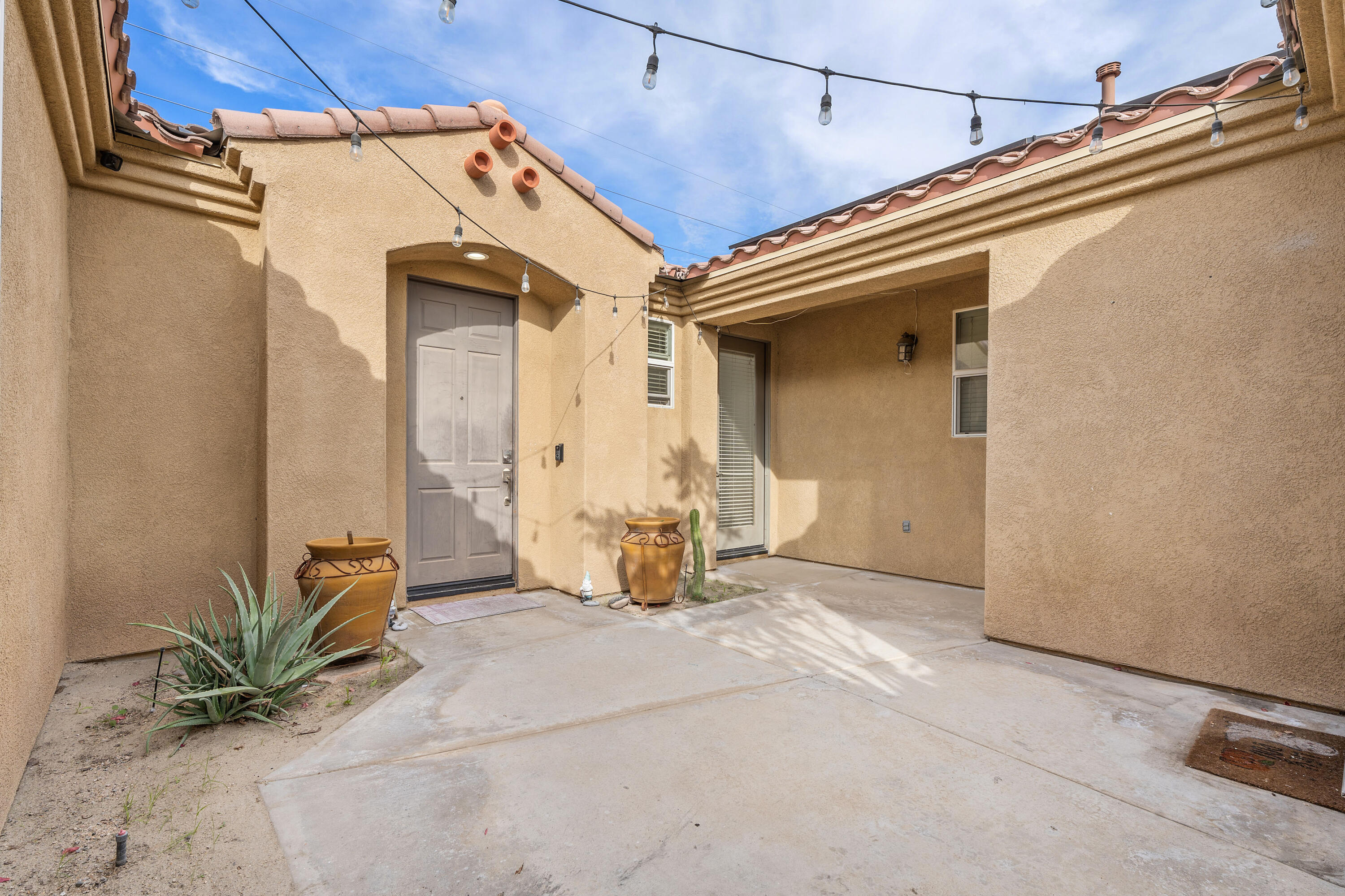 83814 Wolf Creek Road Indio, CA 92203 - Photo 5 of 28 a view of a house with porch