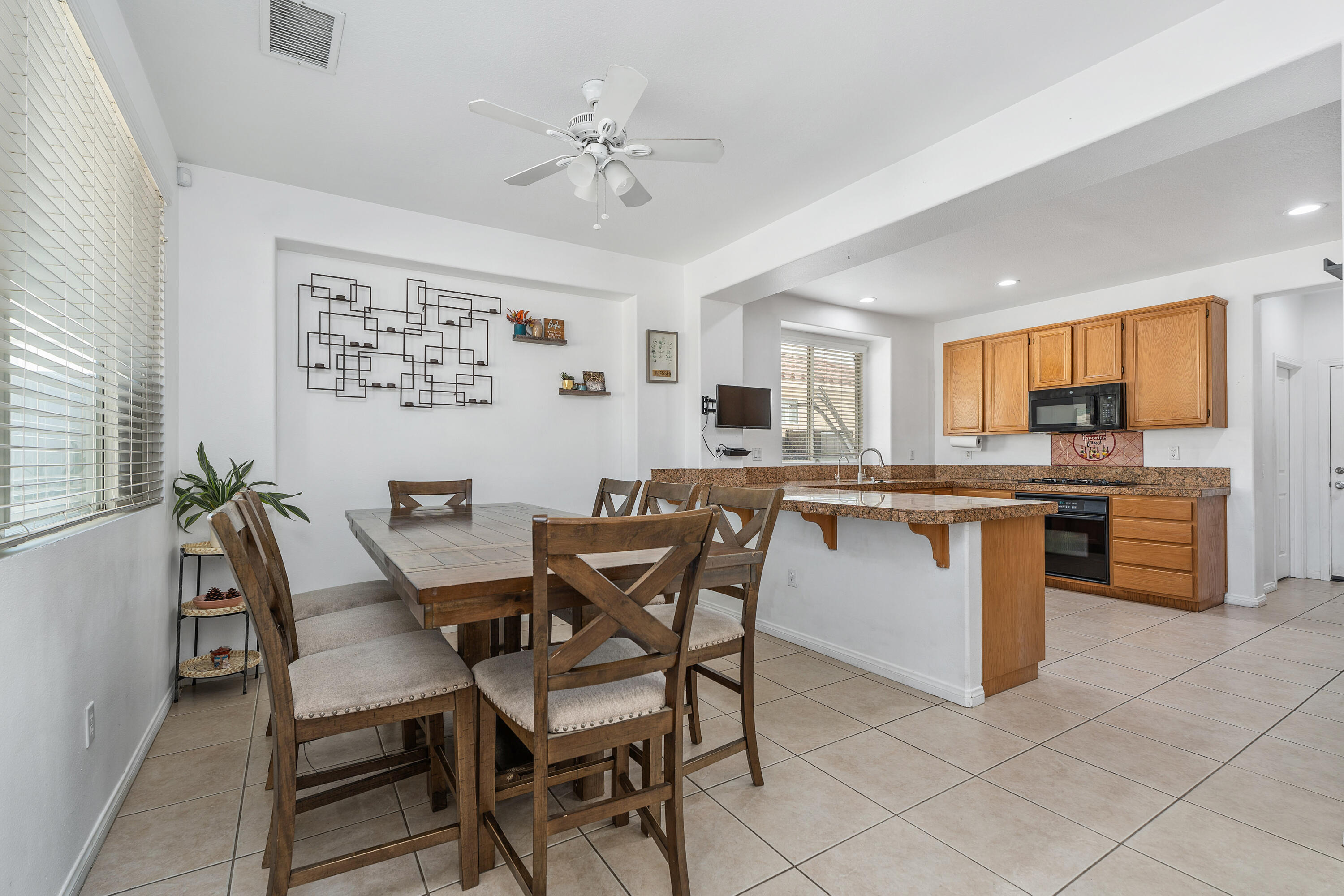 83814 Wolf Creek Road Indio, CA 92203 - Photo 10 of 28 a view of a dining room kitchen and a window