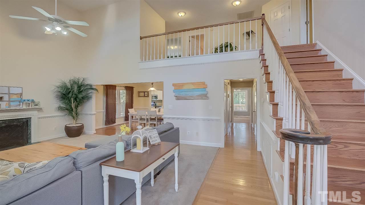 2041 Muirfield Village Way Raleigh, NC 27604 - Photo 2 of 25 Spacious 2 story living room with tons of natural light!