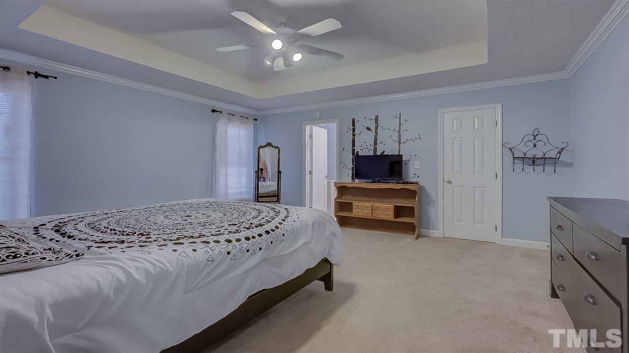 2041 Muirfield Village Way Raleigh, NC 27604 - Photo 10 of 25 Master bedroom has walk-in closet and tray ceiling.
