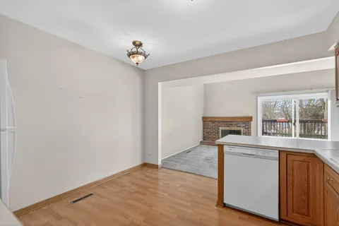 a bathroom with a toilet sink vanity and mirror