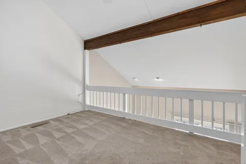 a view of a hallway with staircase