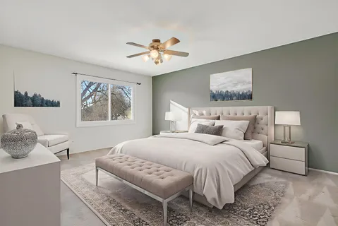 an empty room with a ceiling fan and a window