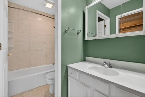 a bathroom with a bathtub and toilet