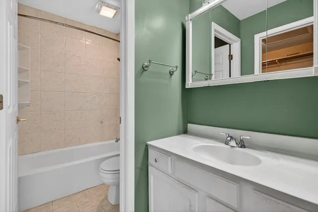 a bathroom with a bathtub and toilet