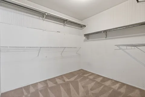 a view of an empty room with stairs