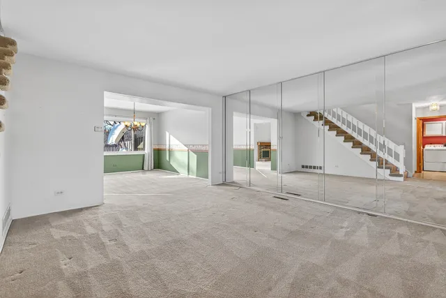 a view of empty room with a fireplace