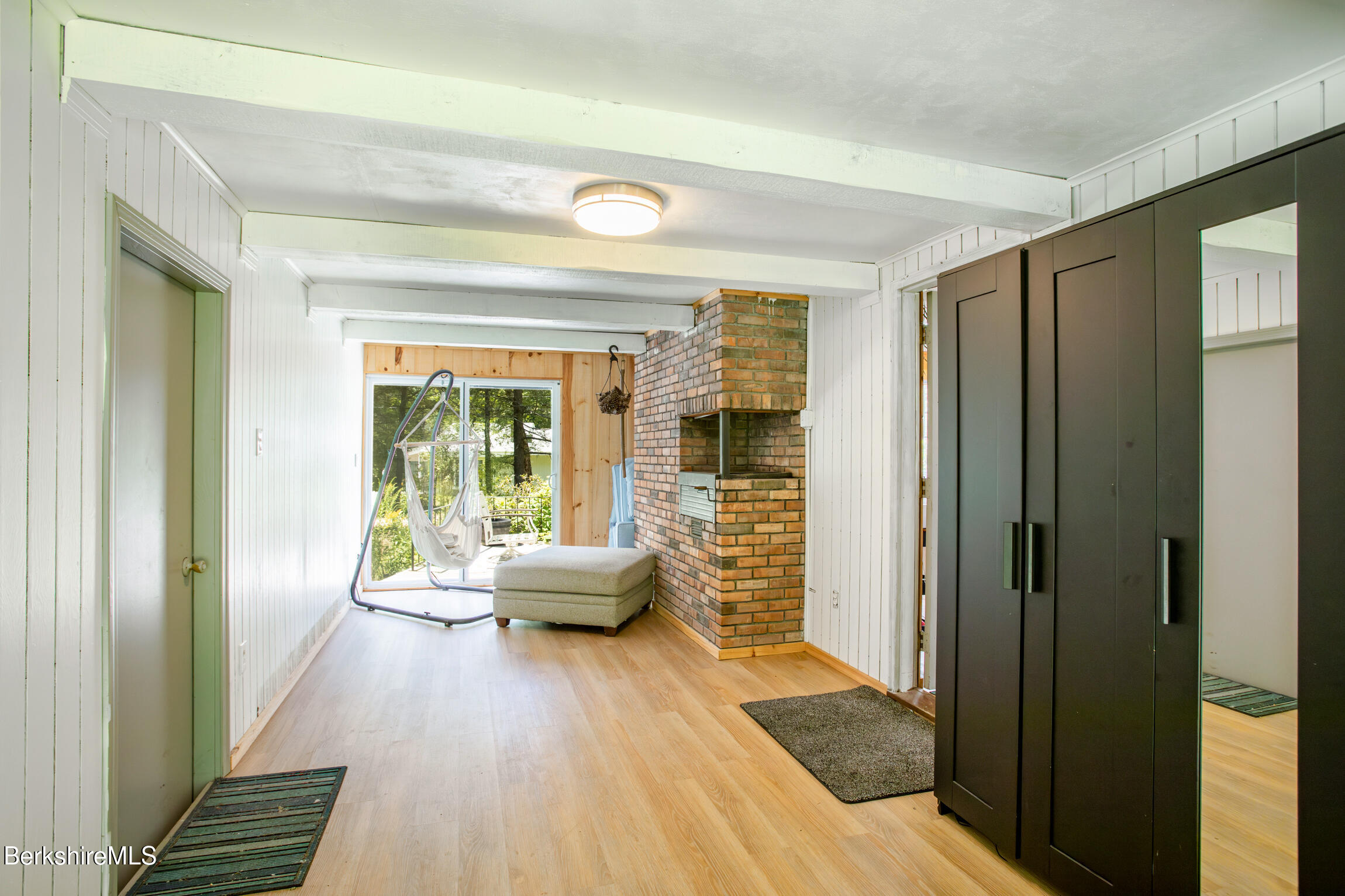 50 Beach Road Becket, MA 01223 - Photo 15 of 31 a living room with furniture and wooden floor