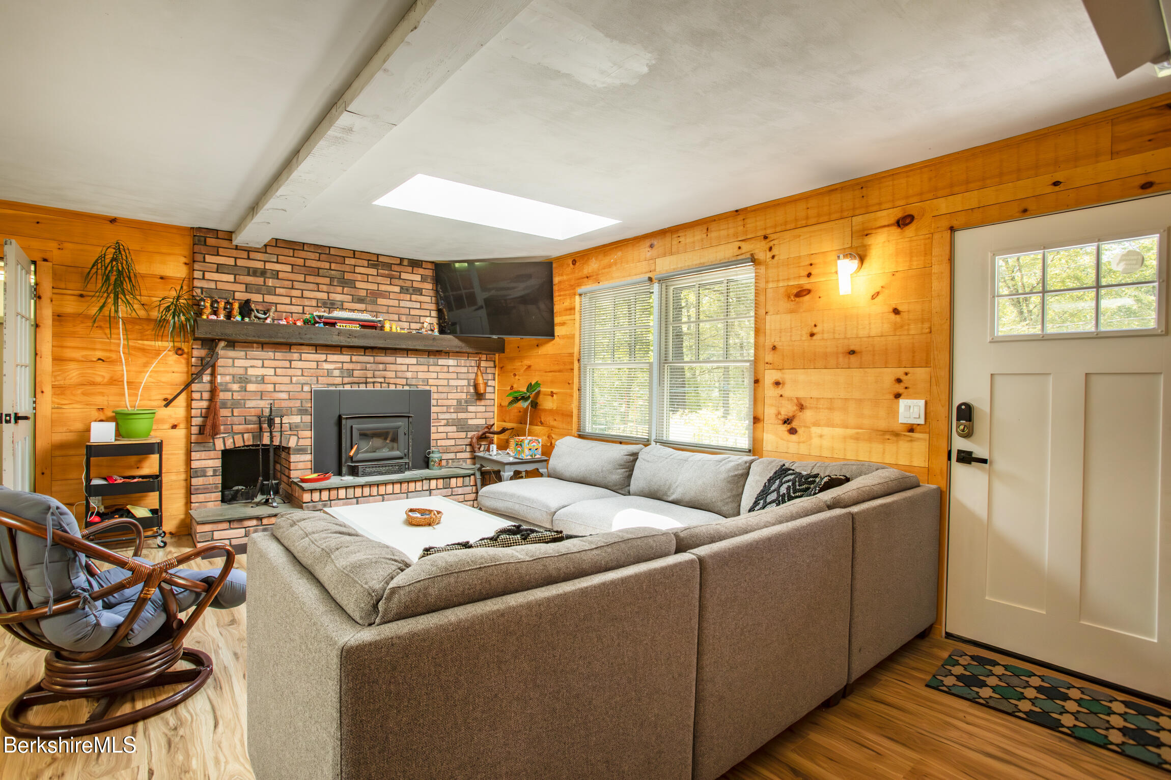 50 Beach Road Becket, MA 01223 - Photo 8 of 31 a living room with furniture and a fireplace