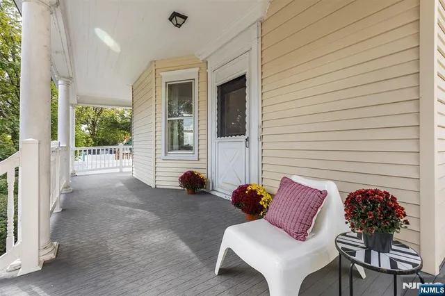 a view of a patio with a chairs and table in a patio