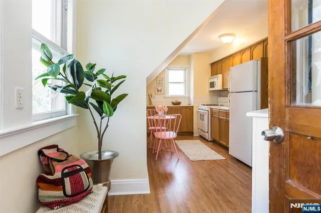 a living room filled with furniture window and wooden floor