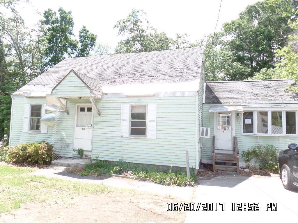 58 Baldwin Road Billerica, MA 01821 - Photo 15 of 15 a front view of a house with a yard and garage