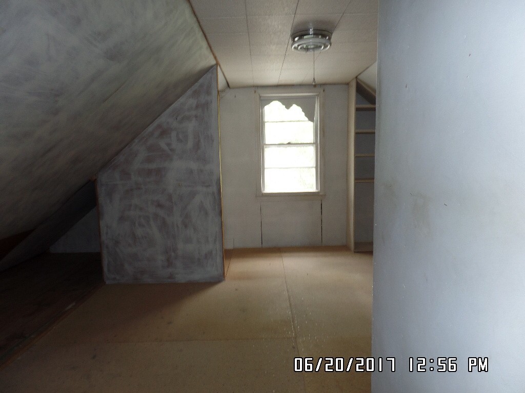 58 Baldwin Road Billerica, MA 01821 - Photo 6 of 15 a view of an empty room with a window