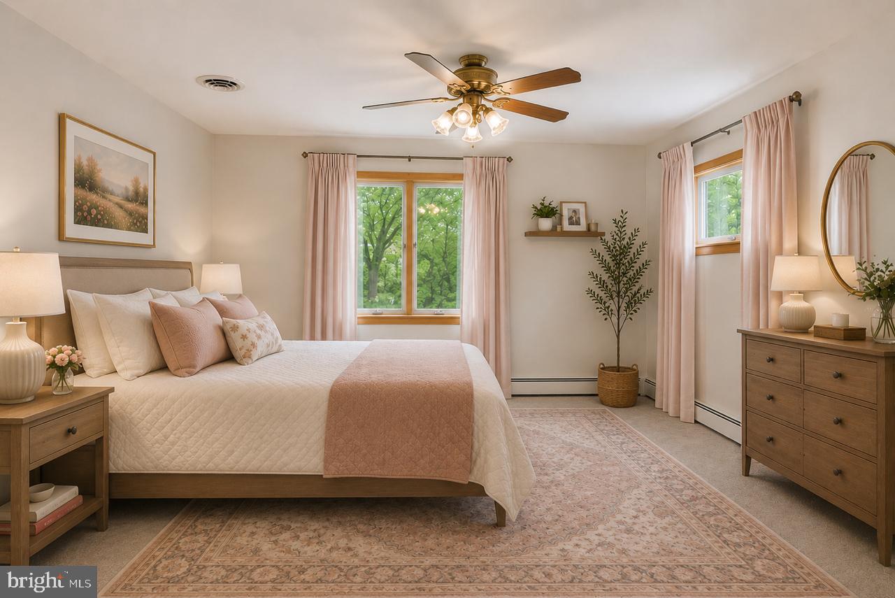 1403 Disney Road Severn, MD 21144 - Photo 18 of 39 a bedroom with a large bed and a window