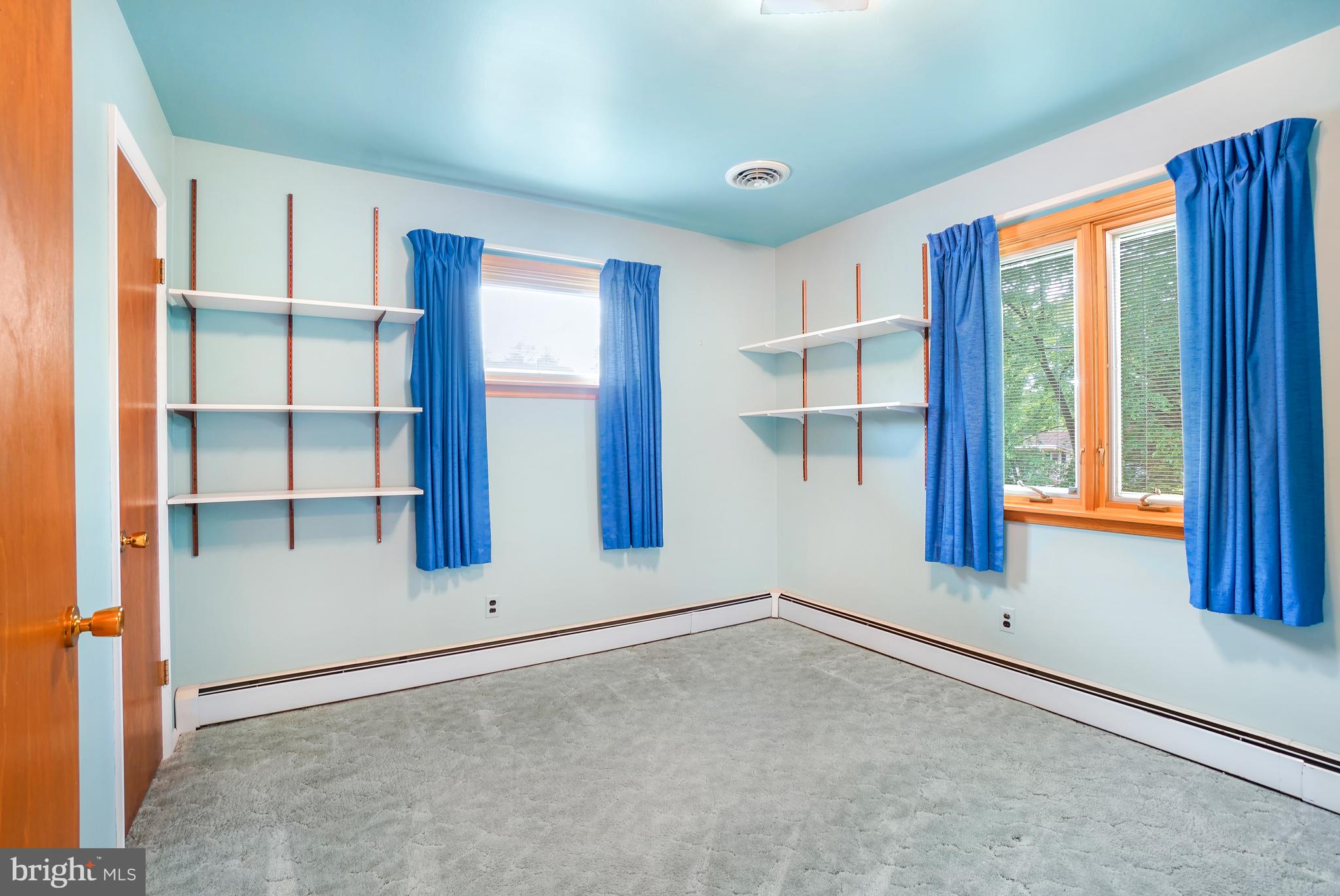 1403 Disney Road Severn, MD 21144 - Photo 22 of 39 an empty room with windows and closet