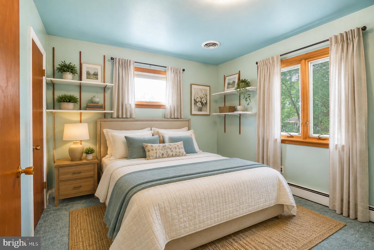 1403 Disney Road Severn, MD 21144 - Photo 23 of 39 a bedroom with a large bed and a window