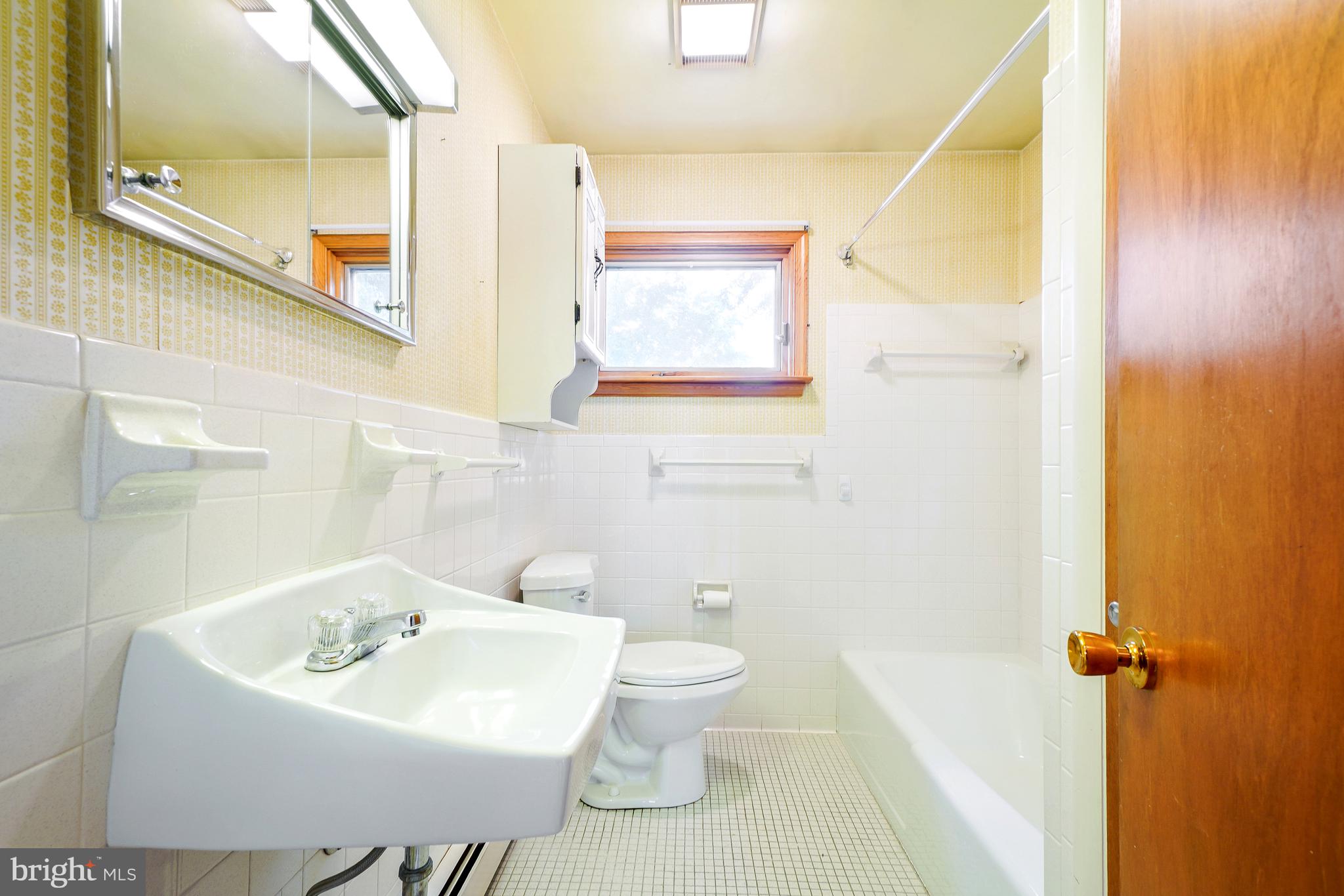 1403 Disney Road Severn, MD 21144 - Photo 24 of 39 a bathroom with a sink a toilet and mirror