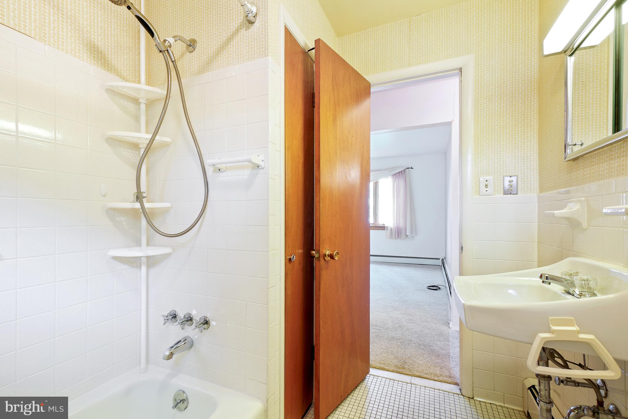 1403 Disney Road Severn, MD 21144 - Photo 26 of 39 a bathroom with a sink and a mirror