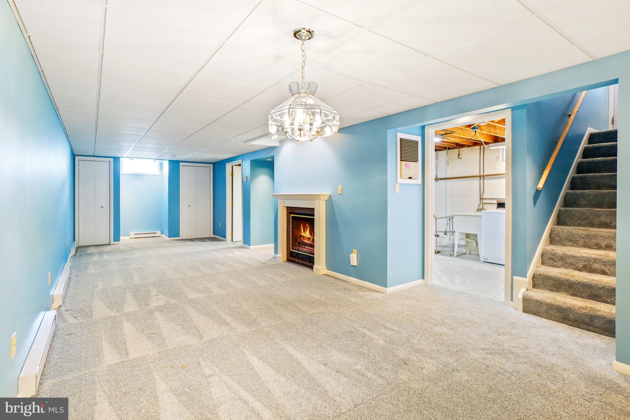 1403 Disney Road Severn, MD 21144 - Photo 27 of 39 a view of an empty room with a fireplace