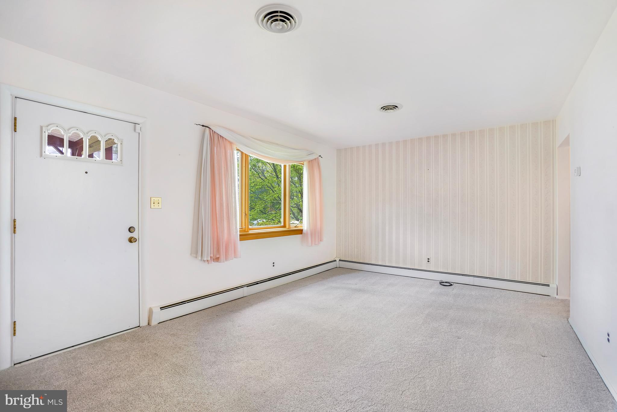 1403 Disney Road Severn, MD 21144 - Photo 8 of 39 a view of an empty room with a window