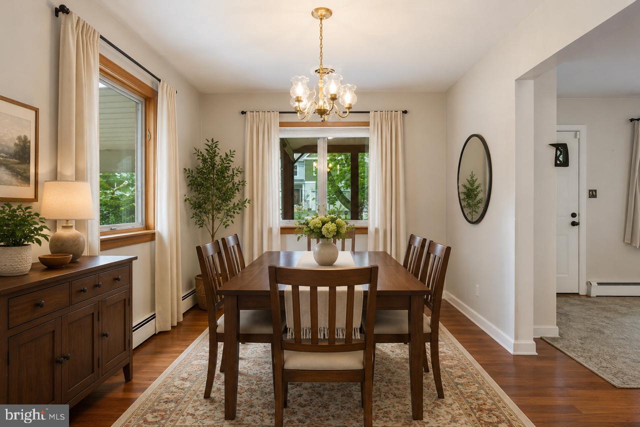 1403 Disney Road Severn, MD 21144 - Photo 10 of 39 a view of a dining room with furniture window and wooden floor
